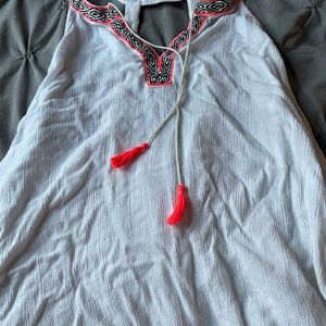 White open back tank top with neon orange